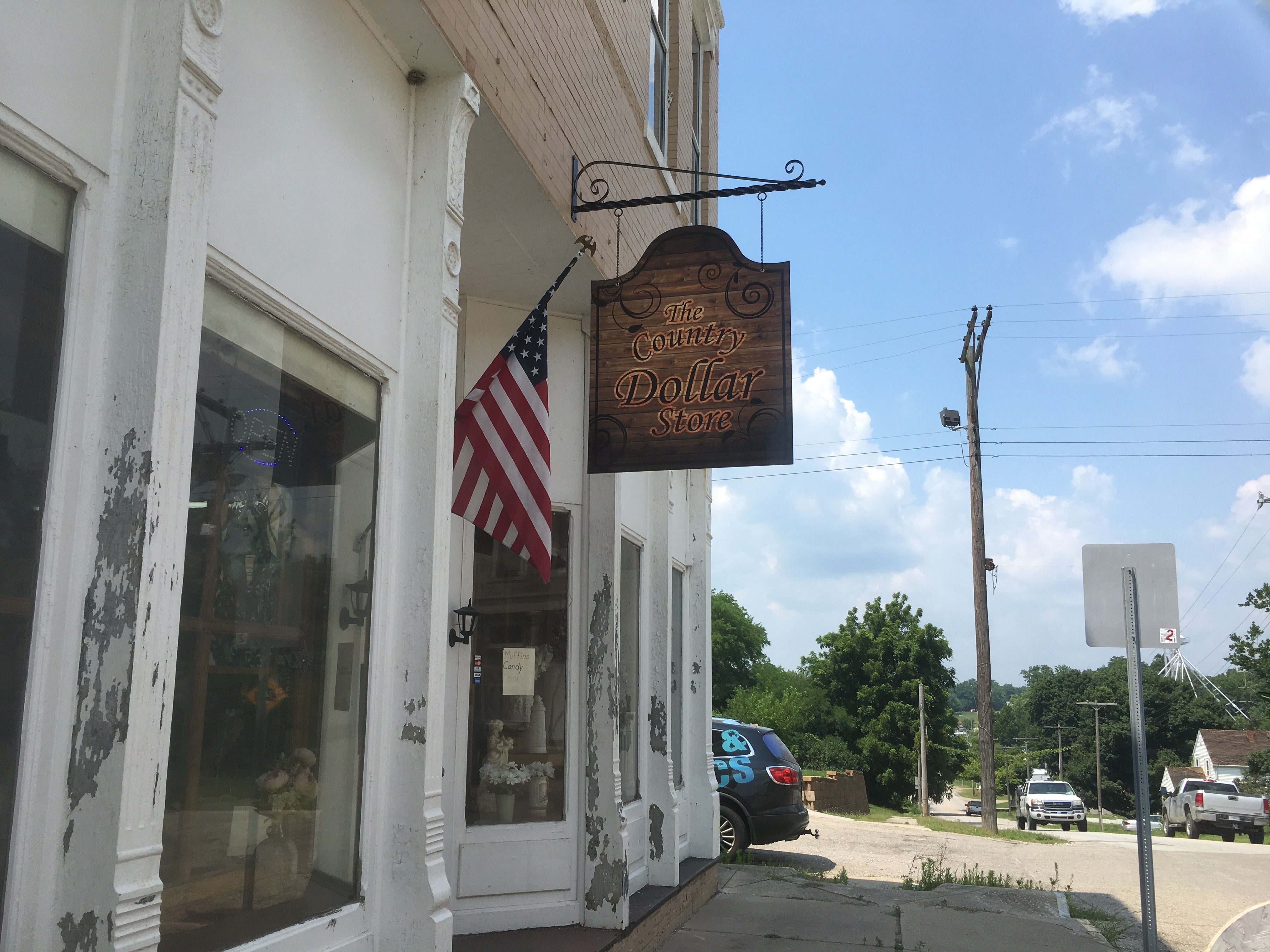 Scroll Bracket Sign for The County Dollar Store