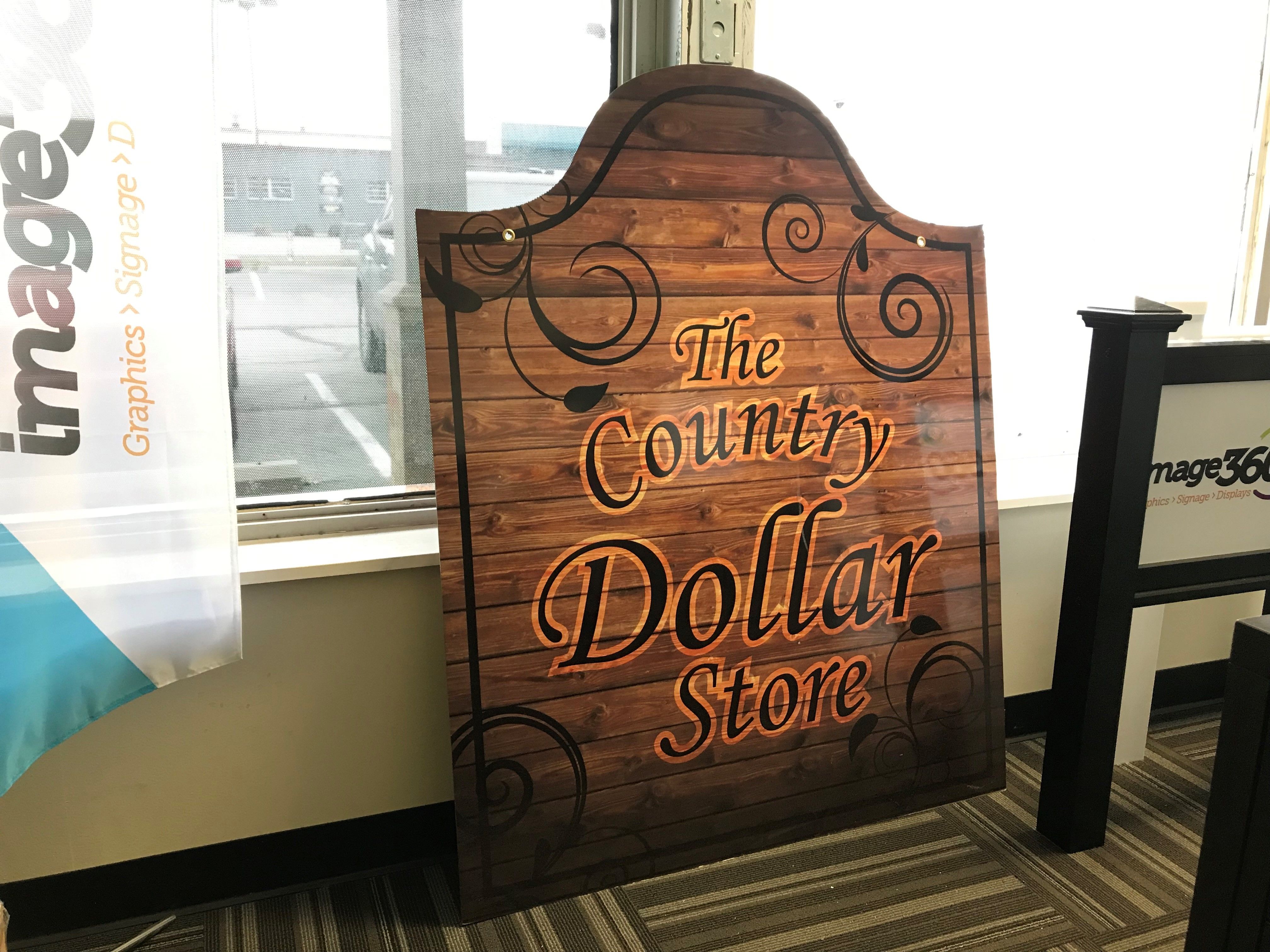 Scroll Bracket Sign for The County Dollar Store