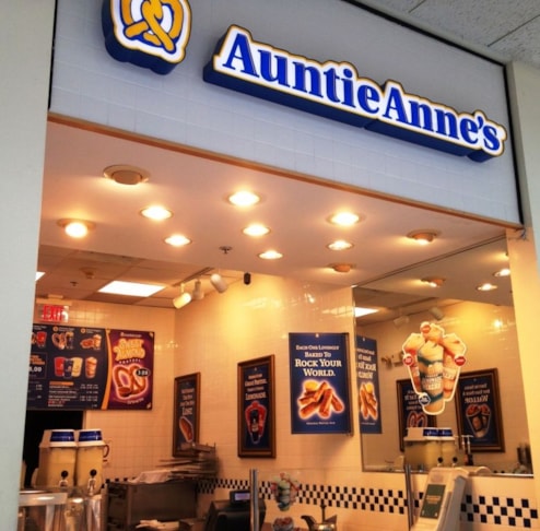 Point-of-purchase or POP signage has been shown to increase sales by as much as 65%. (Digitally Printed Window Cling by Signs Now Cincinnati for Auntie Annes Pretzels, Tri-County Mall, Cincinnati, OH)