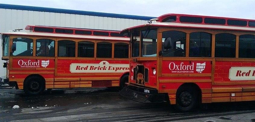 Get around in style with our digitally printed wraps and installation services (Digitally printed wraps by Signs Now Cincinnati for Miami University Red Brick Express, Oxford, OH)