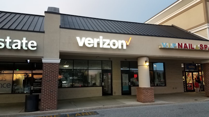 Lighted channel letter sign on raceway