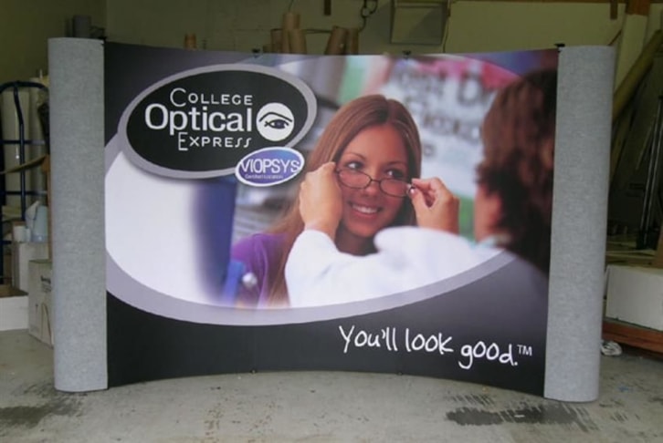 Magnetic popup display system with velcro receptive fabric backwall