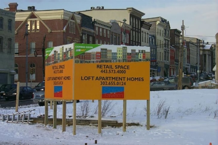 Real estate sign advertising commercial and residential space