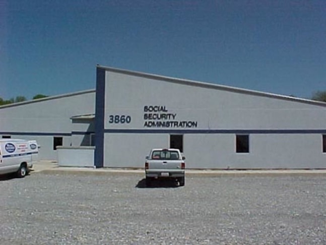 Three dimensional sign custom cut and mounted to surface of building