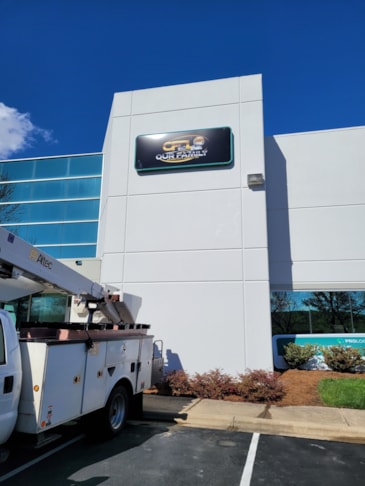 Theres no such thing as too high when it comes to installing signs!  A lit cabinet sign is a great option to show where your business is located.