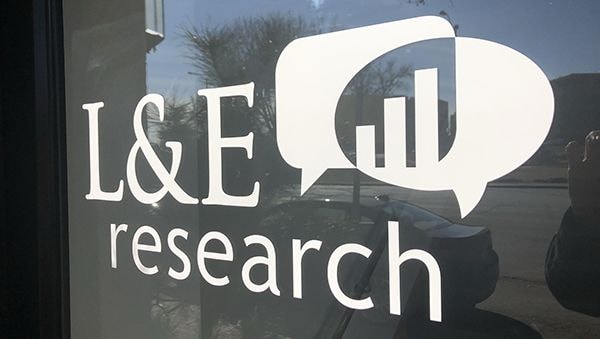 Cut White Vinyl Door Graphic for L & E Research in Kansas City, Missouri