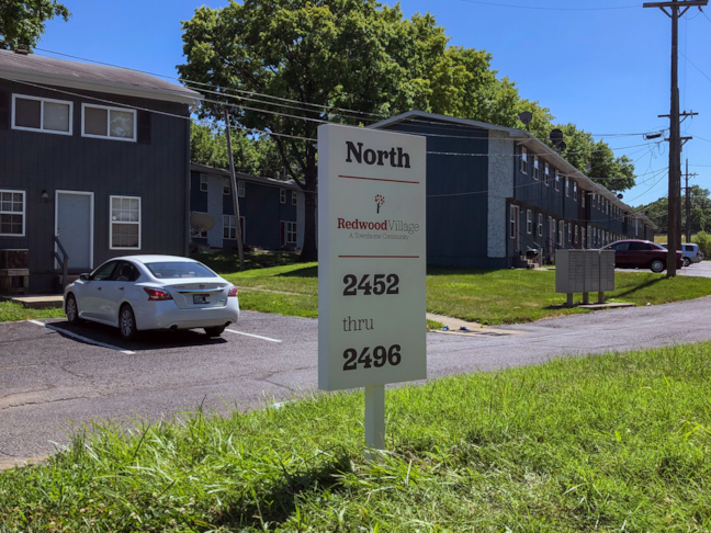 Post and Panel Wayfinding Sign for Redwood Apartments in Kansas City, Kansas