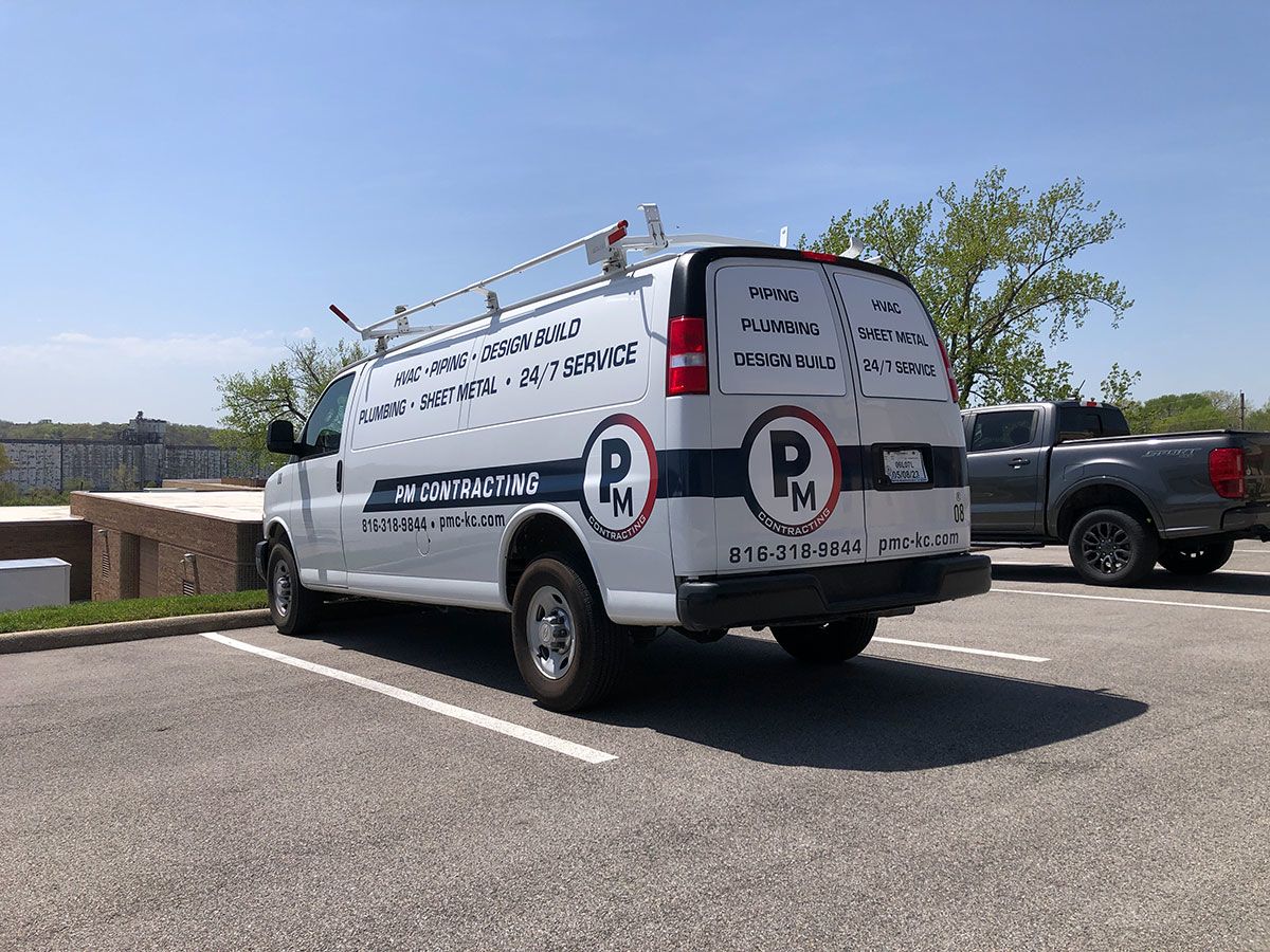 Partial Vehicle Fleet Graphics for PM Contracting in Grandview, Missouri