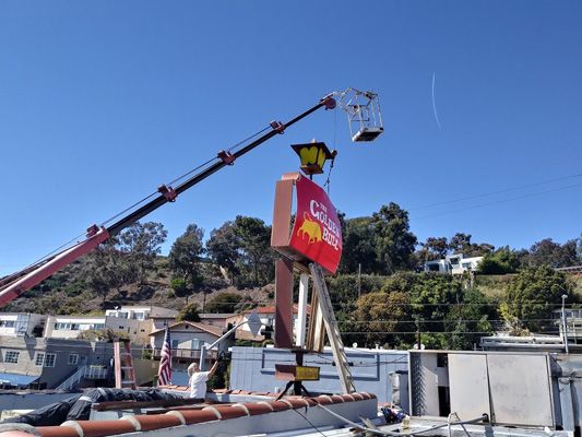 custom illuminate sign faces golden bull chophouse digitally printed signs crane installation.jpg