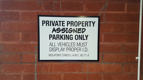eoffices printed sign on brick wall digitally printed luster laminate 3m aluminum sign.jpg