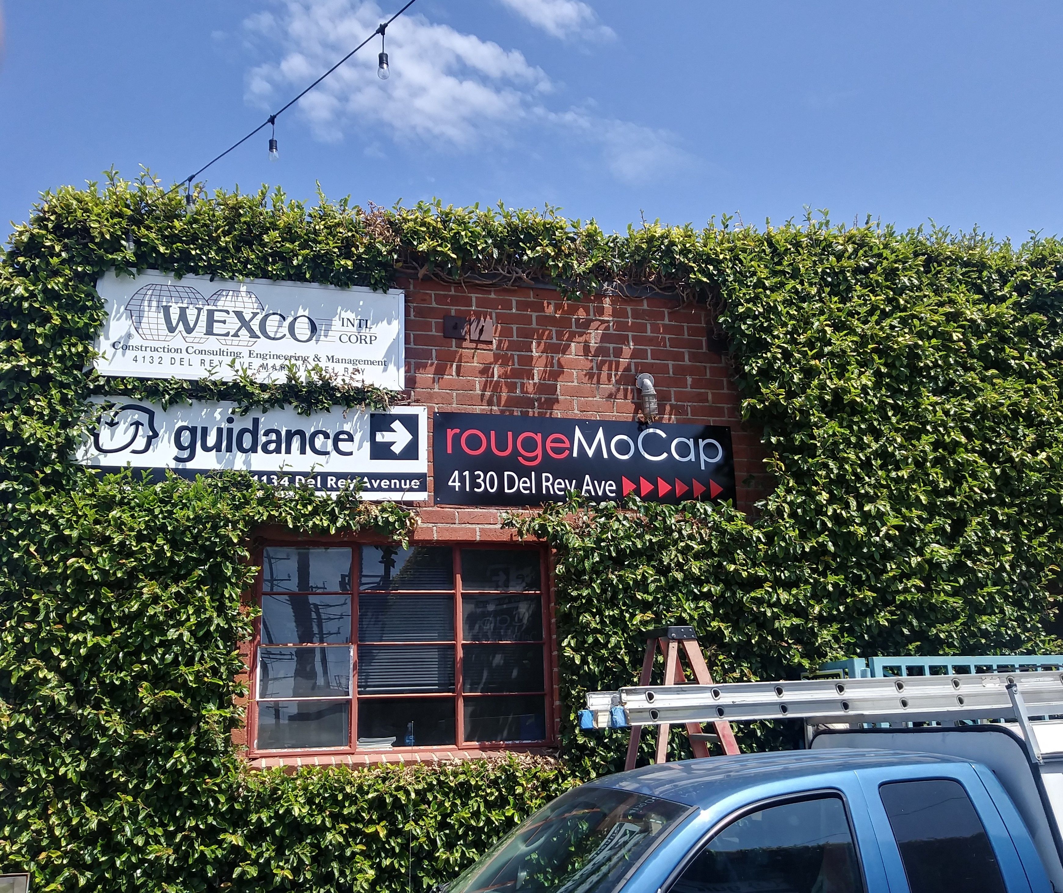 Rogue Digitally Printed Sign vinyl installation.jpg