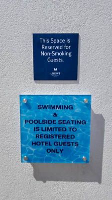 Loews hotel sub surface sign hollywood acrylic stand offs design pool digital print decal install