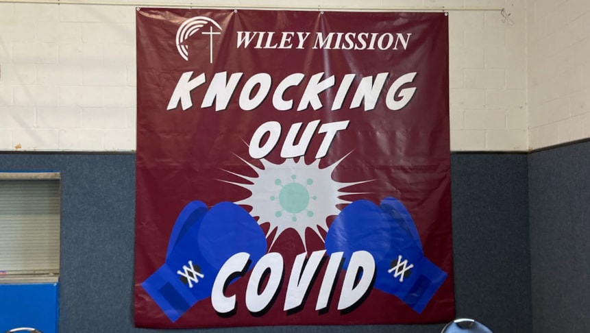 Indoor banner for Wiley Mission while administering the COVID vaccine