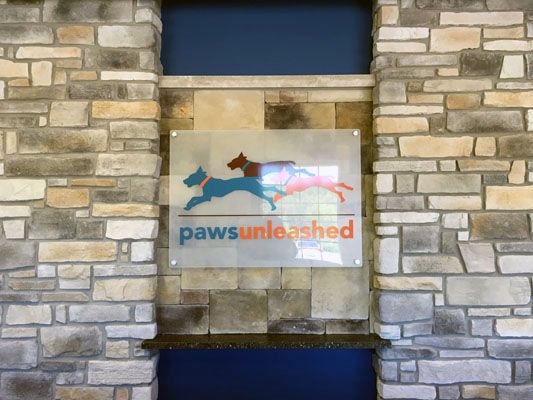 Acrylic sign with graphics and standoffs for Paws Unleashed Woodbury, MN