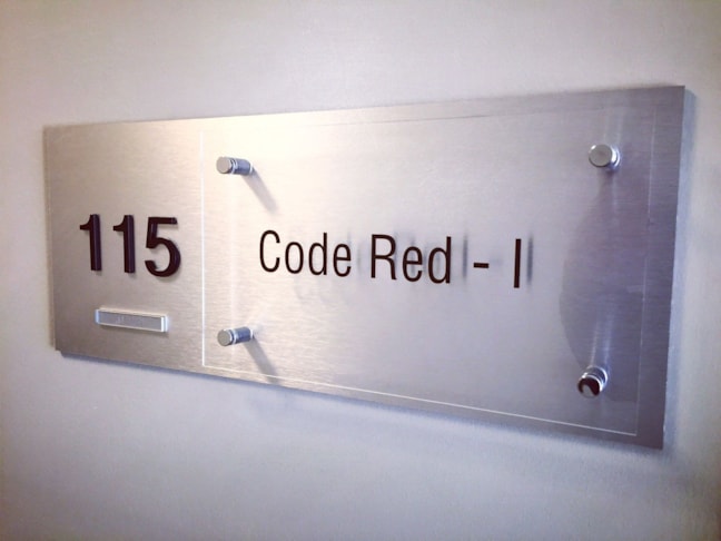 Custom Suite Plaque with Braille and Tactile Lettering