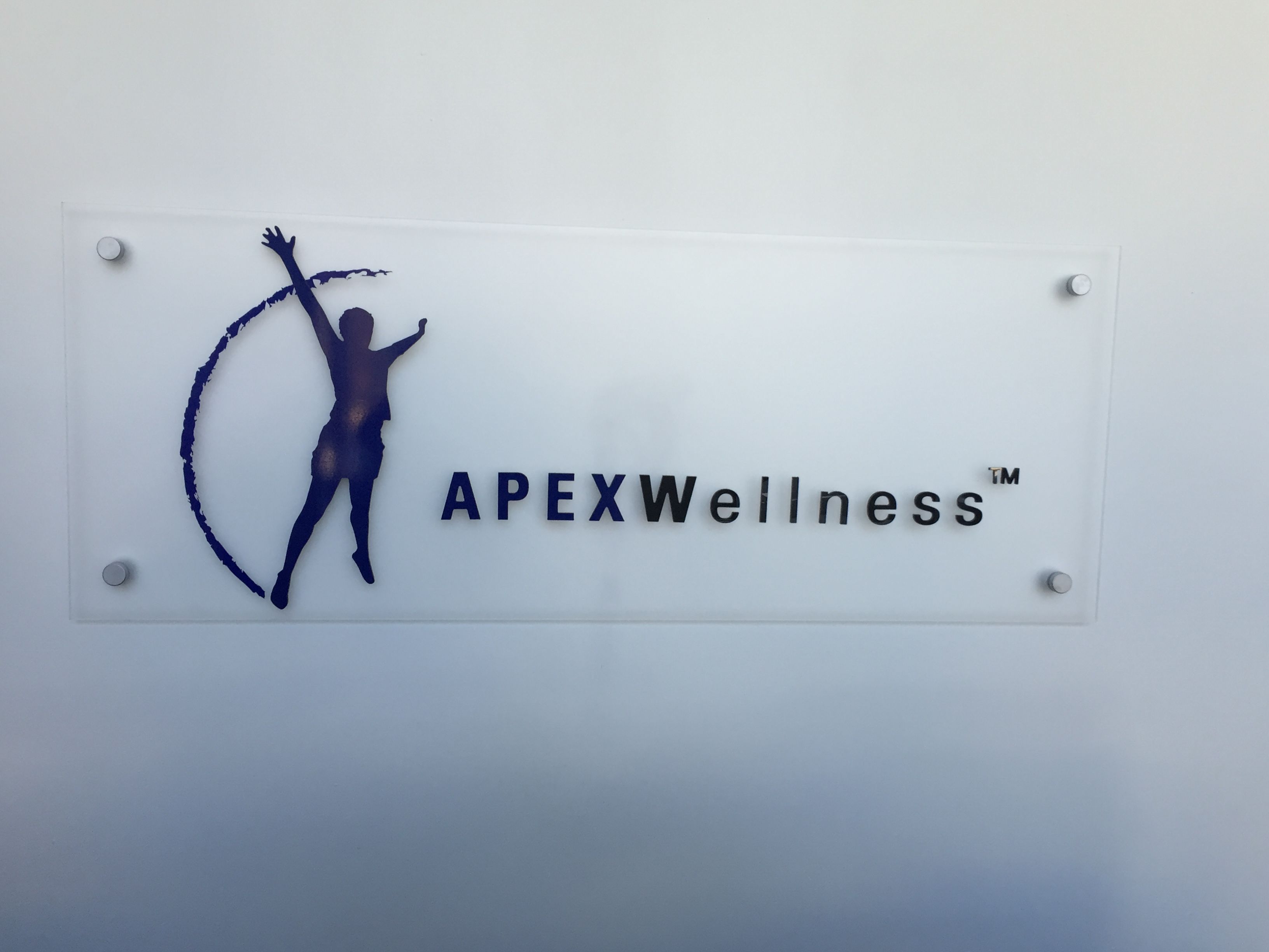 Reception signs for APEX Wellness in San Francisco, CA
