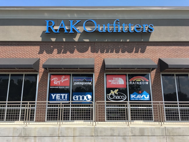 Window signage for a clothing chain in Kennesaw, Ga.