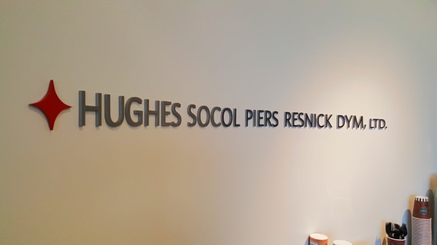 Dimensional letters on curved wall in conference room at law practice in Chicago, IL