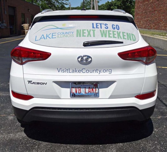 Perforated vinyl (window perf) wrap graphic one way visionfor convention and visitors center. Lake County, IL