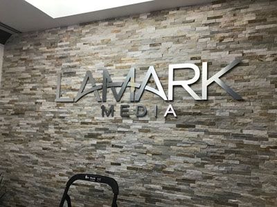 Brushed metal signage for Lamark Media