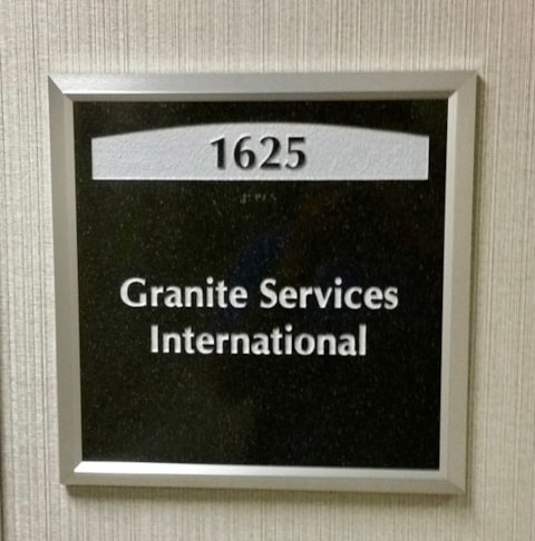 One Tampa City Center Suite ADA Plaque with Copy Engraved into Stone and Paint Filled. ADA Sign with Braille Copy at the Bottom.