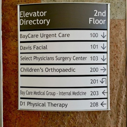 Custom Indoor Directory with Curved Frame and Changeable Copy Inserts